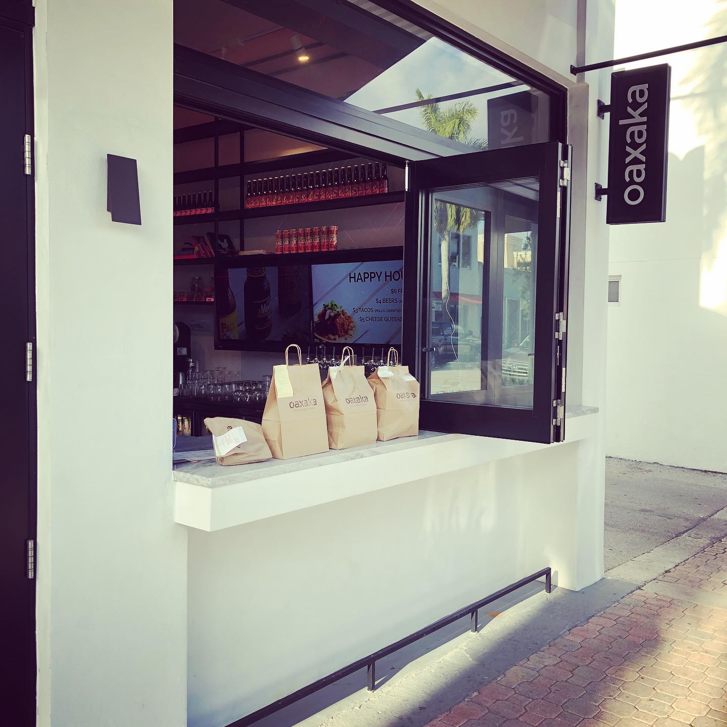 Oaxaka carry out bags on the pickup window counter