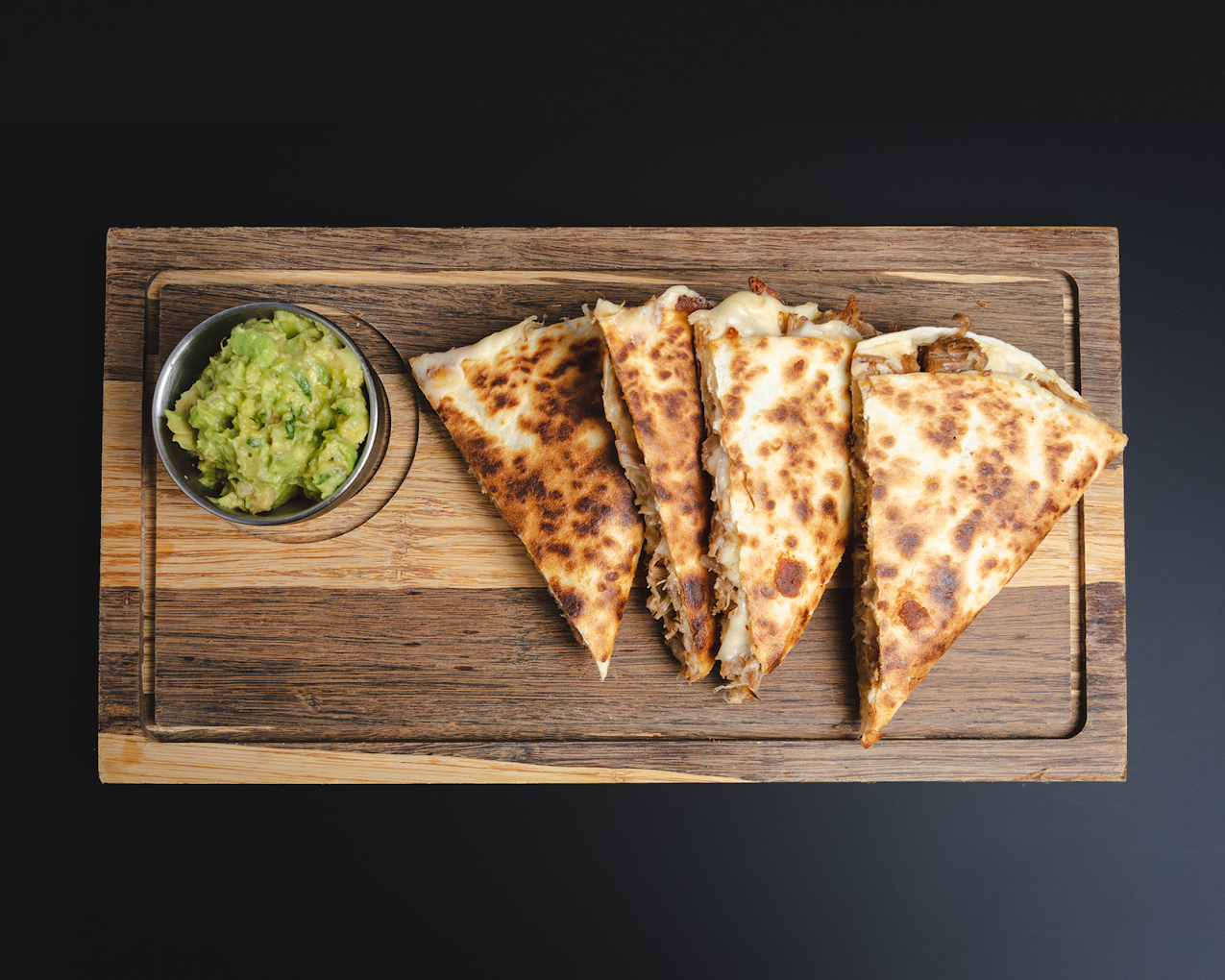 Quesadilla platter with guacamole for sharing